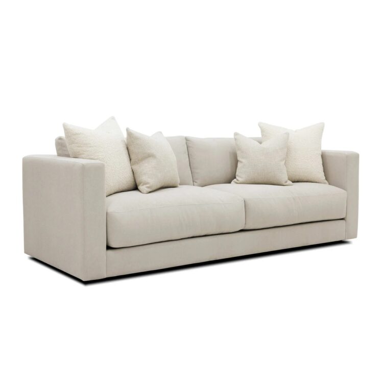 Pale grey sofa with high square arms, and extra thick seat cushions.